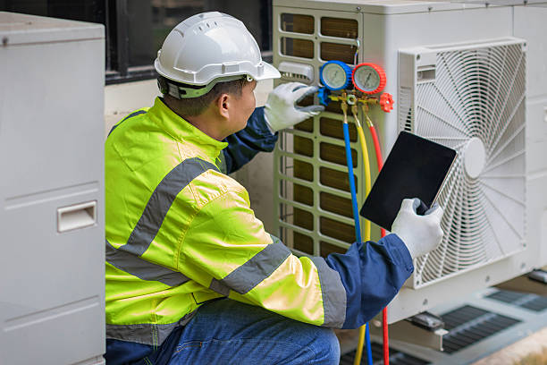 Professional Heat Pump Repair technician working in Winchester, IN